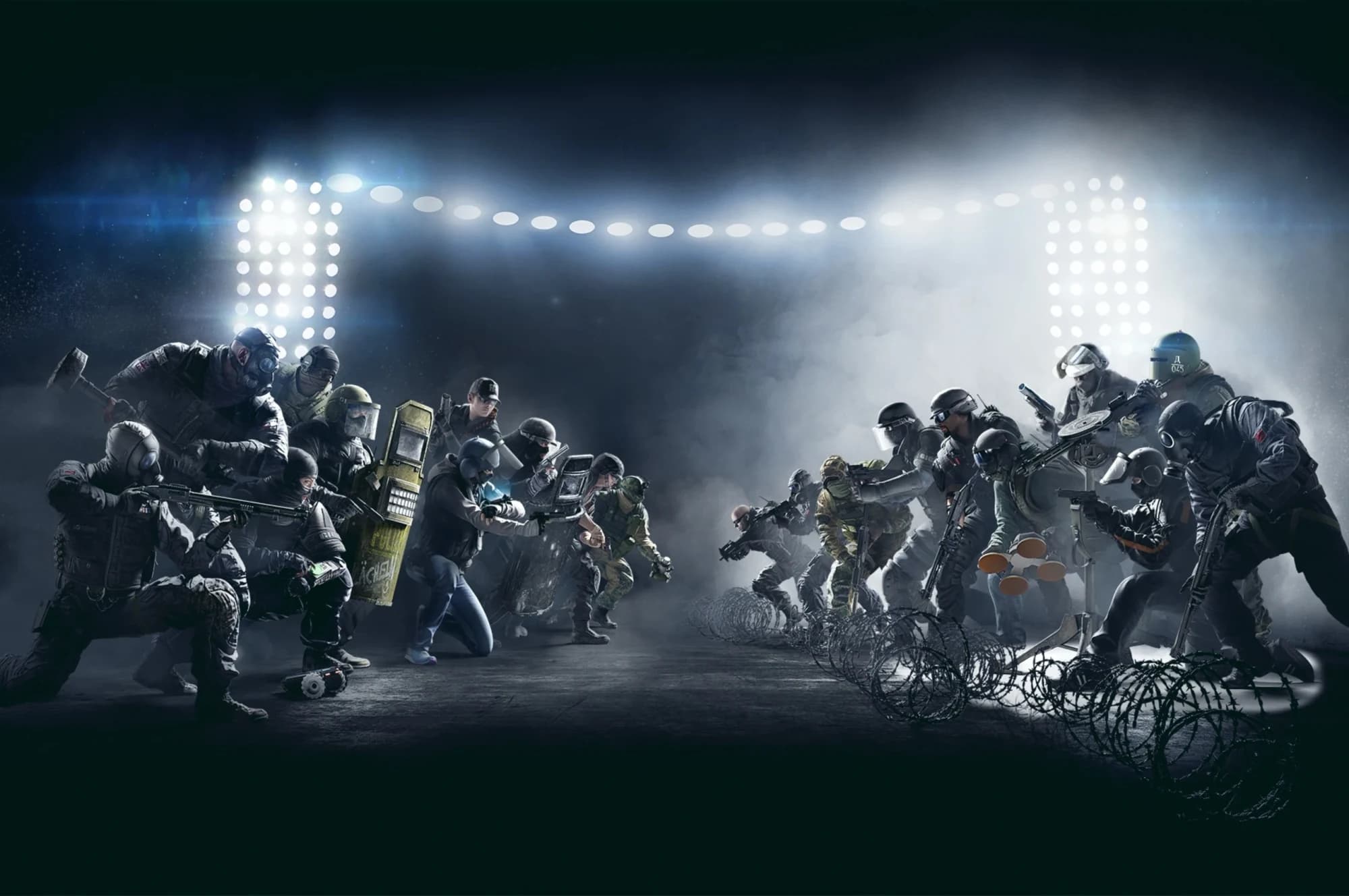 Rainbow Six Siege key art: two squads of operators in tactical gear crouch facing each other across a dark arena under floodlights, barbed wire and smoke between them.